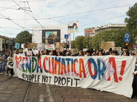 Students from the Friday for Future movement at the head of the event display a banner calling for more political attention to the climate a...