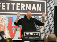 John Fetterman, Democratic candidate for Senator raises his arms as he is welcomed on stage by 600 supporters during a campaign event with C...