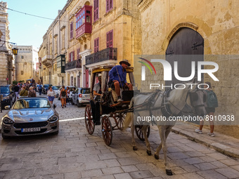 People visiting the historical city on the horse cart are seen in Mdina, Malta on 23 September 2022 Mdina (former Melite) is a fortified cit...