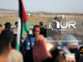 Palestinians gather during a demonstration in support of the Al-Aqsa mosque next to the border fence with Israel, east of Gaza City, on Sept...