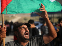 Palestinians shout slogans during a demonstration in support of the Al-Aqsa mosque next to the border fence with Israel, east of Gaza City,...