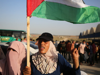 Palestinians shout slogans during a demonstration in support of the Al-Aqsa mosque next to the border fence with Israel, east of Gaza City,...