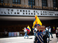 A demonstrator holds a sign that reads 'No To Narcoterrorist Comunism' during the first antigovernment protest against left-wing president G...