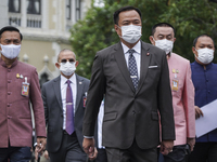 Thai Health Minister Anutin Charnvirakul (C) arrives for a cabinet meeting at Government House in Bangkok, Thailand, 27 September 2022. (