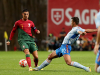 Cristiano Ronaldo of Portugal (L) vies with Rodri of Spain during the UEFA Nations League Group A2 football match between Portugal and Spain...