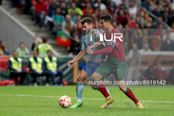 Cristiano Ronaldo of Portugal (R ) vies with Jose Gaya of Spain during the UEFA Nations League Group A2 football match between Portugal and...