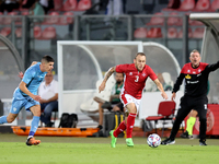 


Ryan Camenzuli (C) of Malta moves forward with the ball during the friendly international soccer match between Malta and Israel at the Na...
