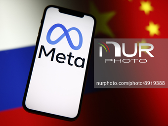 The Meta logo is seen on a mobile phone with Chinese and Russian flags in the background in this photo illustration in Warsaw, Poland on 27...