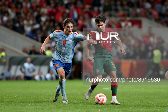 Vitinha of Portugal (R ) vies with Gavi of Spain during the UEFA Nations League Group A2 football match between Portugal and Spain, at the M...