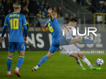 Aaron Hickey of Scotland in action challenged by Vitaliy Mykolenko of Ukraine during the UEFA Nations League 2022/23 match in Group B betwee...