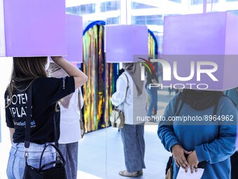 Visitors visit Vivo art exhibition at Lotte Shopping Avenue mall in Jakarta, Indonesia, October 7, 2022. The purpose of the art exhibition i...