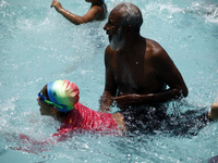 Children are learing swimming in a swimming pool at Dhaka.
Bangladesh is a rivering country,every 31 minutes a Bangladeshi child dies from d...