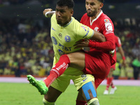 (L) Roger Martinez   of  America and Carlos Guzman of the Toluca Red Devils  fight the ball during the semifinal football match between Tolu...