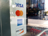 Sticker with credit card companies is seen at the shop in Chicago, United States on October 19, 2022 (