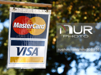 MasterCard and Visa logos are seen near a shop in Washington DC, United States on October 20, 2022 (
