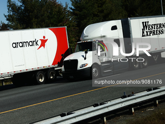Aramark and Western Express logos are seen on a truck semitrailers on the highway in Delaware, United States on October 21, 2022. (