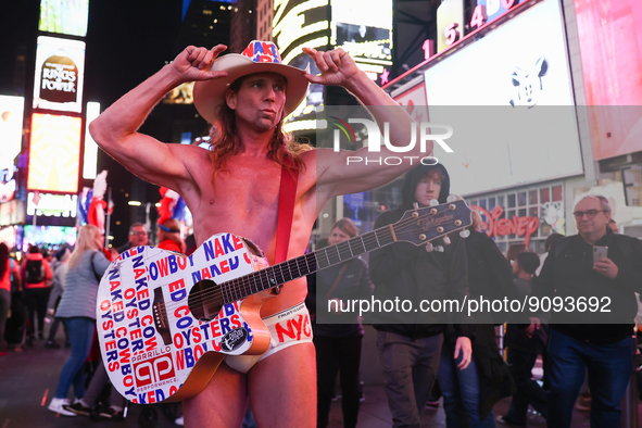 Robert John Burck, the Naked Cowboy, poses for a photo on Times Square in New York City, United States on October 22, 2022. 