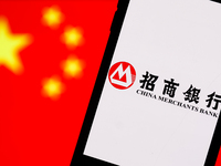 China Merchants Bank logo displayed on a phone screen and Chinese flag displayed on a screen in the background are seen in this illustration...