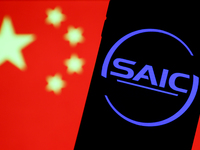 SAIC logo displayed on a phone screen and Chinese flag displayed on a screen in the background are seen in this illustration photo taken in...