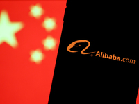 Alibaba.com logo displayed on a phone screen and Chinese flag displayed on a screen in the background are seen in this illustration photo ta...