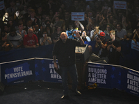 Dem. nominee for U.S. Senate John Fetterman takes the stage during a rally at the Liacouras Center in North Philadelphia, PA, USA on Novembe...