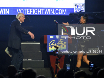 U.S. singer Tinashe welcomes on stage U.S. Senator Bernie Sanders during an Our Future is Now pre-election rally at Franklin Music Hall, in...