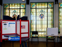 People cast their votes in the US midterm elections at a precinct in Arlington, VA, just outside of Washington, DC.  Voters will elect Congr...