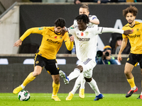 Wolvess Gonalo Guedes and Leeds United's Darko Gyabi battle for the ball during the Carabao Cup match between Wolverhampton Wanderers and Le...