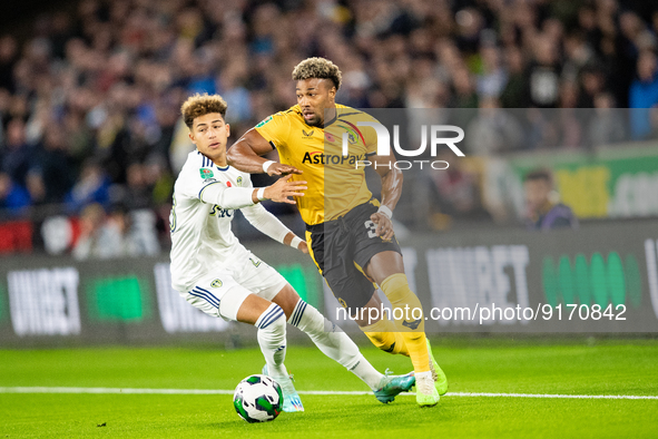 Wolvess Adama Traore and Mateo Joseph of Leeds during the Carabao Cup match between Wolverhampton Wanderers and Leeds United at Molineux, Wo...