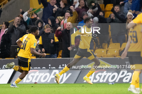 Boubacar Traore of Wolves (R) celebrates scoring their side's first goal of the game during the Carabao Cup match between Wolverhampton Wand...
