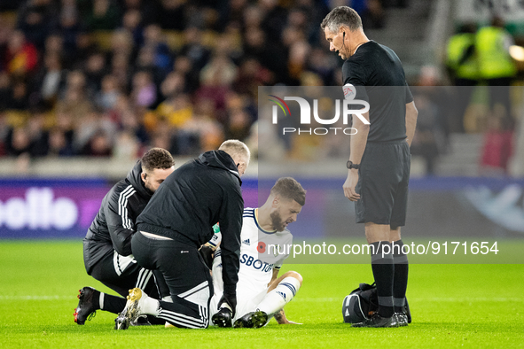 Leeds United's Mateusz Klich receives treatment after being fouled during the Carabao Cup match between Wolverhampton Wanderers and Leeds Un...
