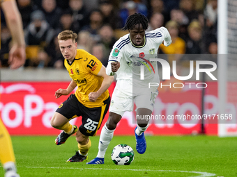 Leeds United's Darko Gyabi and Wolvess Connor Ronan during the Carabao Cup match between Wolverhampton Wanderers and Leeds United at Molineu...