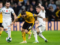 Wolves's Rben Neves and Leeds United's Joe Gelhardt battle for the ball during the Carabao Cup match between Wolverhampton Wanderers and Lee...