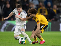 Leeds United's Joe Gelhardt and Wolves's Rayan At-Nouri battle for the ball during the Carabao Cup match between Wolverhampton Wanderers and...