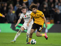 Leeds United's Joe Gelhardt and Wolves's Rayan At-Nouri battle for the ball during the Carabao Cup match between Wolverhampton Wanderers and...