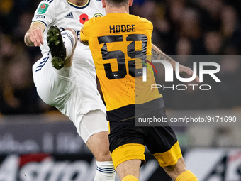 Leeds United's Mateusz Klich and Wolvess Joseph Hodge during the Carabao Cup match between Wolverhampton Wanderers and Leeds United at Molin...