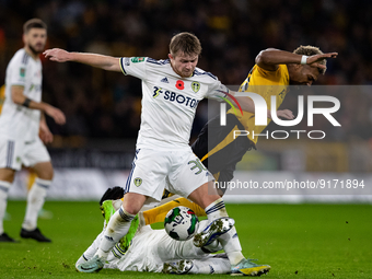 Leeds United's Joe Gelhardt and Wolvess Adama Traore battle for the ball during the Carabao Cup match between Wolverhampton Wanderers and Le...