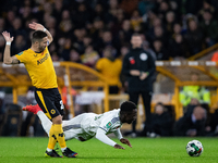 Leeds United's Wilfried Gnonto is fouled by Wolvess Joao Moutinho during the Carabao Cup match between Wolverhampton Wanderers and Leeds Uni...