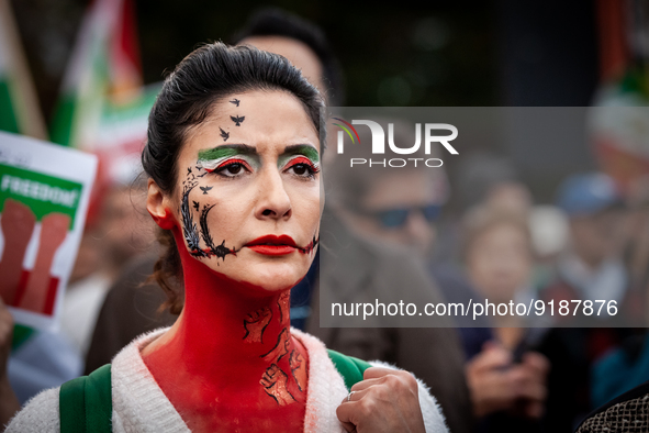 A demonstrator wears elaborate face paint during a march for Mahsa (Zhina) Amini and those protesting her death in Iran.  After the really,...