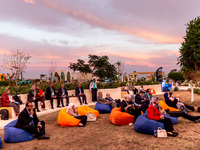 Visitors rest in the evening in the Green Zone of the COP27 UN Climate Change Conference, held by UNFCCC in Sharm El-Sheikh International Co...