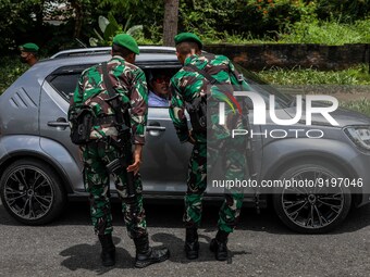Indonesian Army personnel inspects a car at a checkpoint before entering Garuda Wisnu Kencana (GWK) Cultural Park in South Kuta, Badung, Bal...