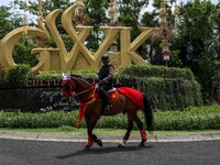 Horse-mounted police officers on patrol outside Garuda Wisnu Kencana (GWK) Cultural Park in South Kuta, Badung, Bali, Indonesia, Tuesday, No...