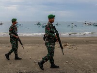 Indonesian Army personnel patrol at a beach near Ngurah Rai International Airport during the G20 Summit in Kuta, Badung, Bali, Indonesia, Tu...