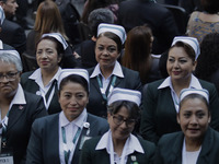 A group of nurses during the 113 Ordinary Assembly of the Mexican Social Security Institute at the National Palace in Mexico City, headed by...