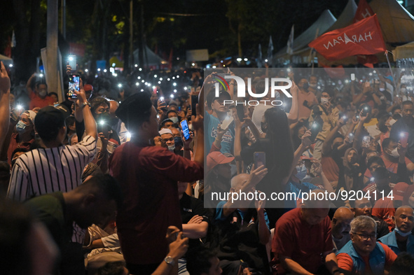 Supporters of Malaysian opposition leader Anwar Ibrahim cheering as during an election campaign ahead of Malaysias 15th general election in...