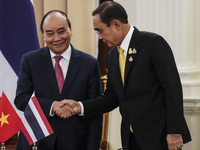 Vietnam President Nguyen Xuan Phuc with Thai Prime Minister Prayut Chan-o-cha during a press conference at Government House in Bangkok, Thai...