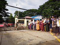 Relatives wait for the release of prisoners from Insein Prison in Yangon, Myanmar on November 17, 2022. (