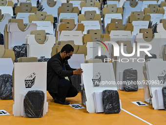Election commission worker make final checks on ballot boxes and voting equipments ahead of general election in Shah Alam, Malaysia on Novem...
