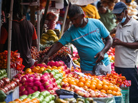 A vendor waits for customers in his fruit shop at Pettah main Market in Colombo on November 21, 2022. (