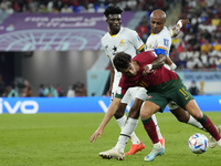 Joao Felix Second Striker of Portugal and Atletico de Madrid and Andre Ayew Left Winger of Ghana and Al-Sadd SC compete for the ball during...